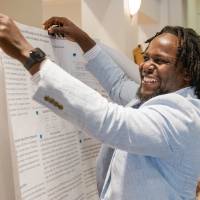 Samuel setting up his poster